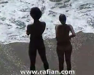 African and milky gals sunbathing on bare beach