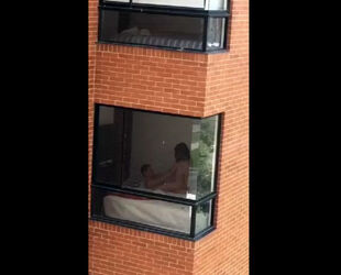 Spycam fuckfest flick filmed thru dormitory balcony window